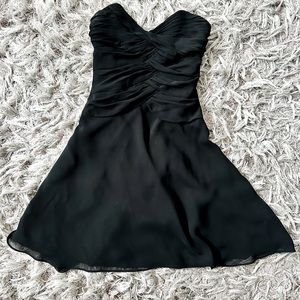 In perfect condition, worn once! White House Black Market black strapless dress.
